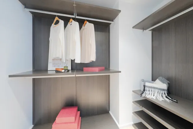 a en suite bathroom with a double vanity sink and a mirror