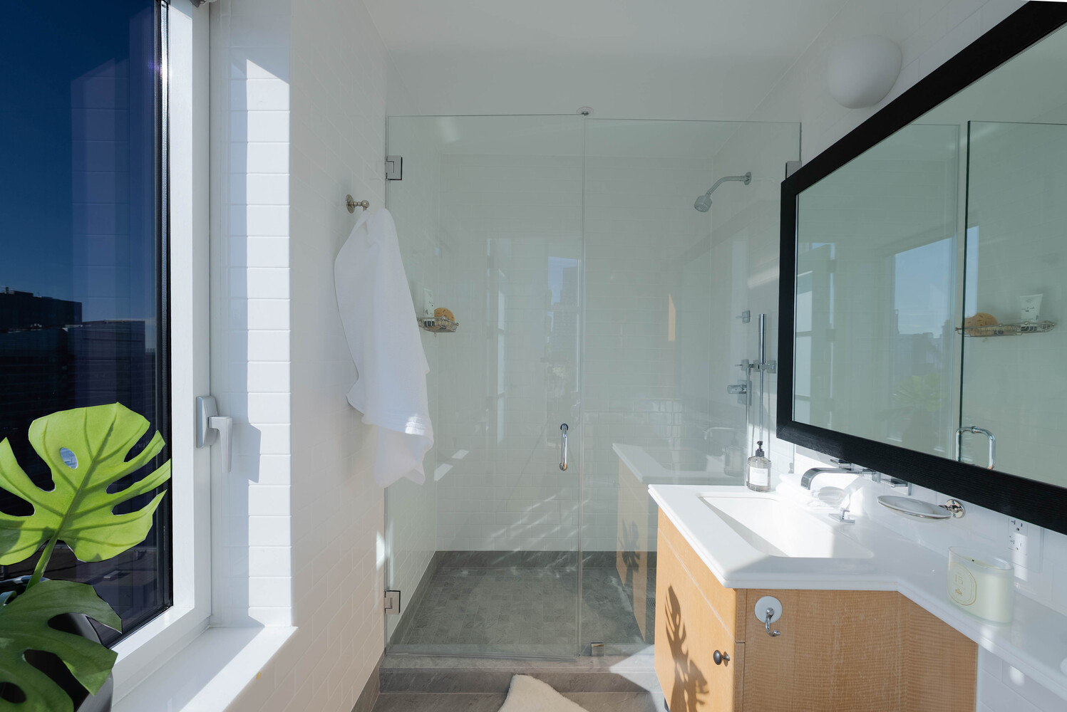 555 West 59th Street, Unit PHC Manhattan, NY 10019 - Photo 22 of 27 a bathroom with a sink and a mirror