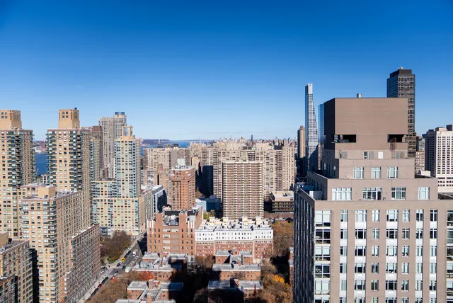 a balcony with furniture and a garden