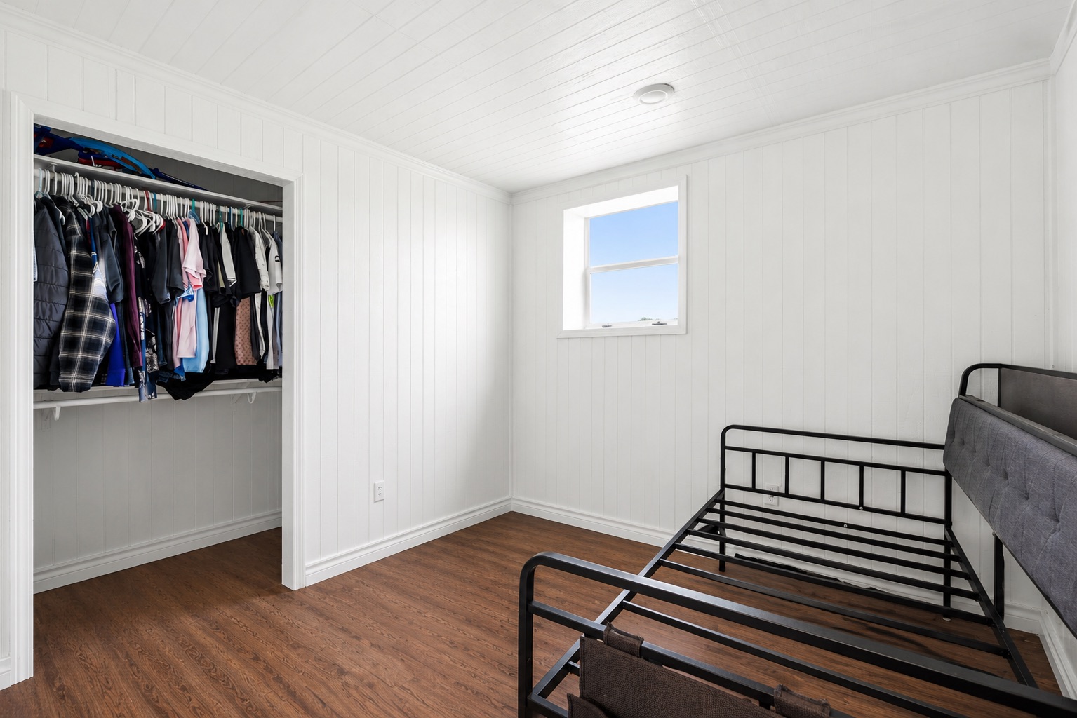 1701 County Road 466 Elgin, TX 78621 - Photo 11 of 24 A comfortable bedroom features sturdy bunk beds, sleek hardwood flooring, and a convenient built-in closet.
