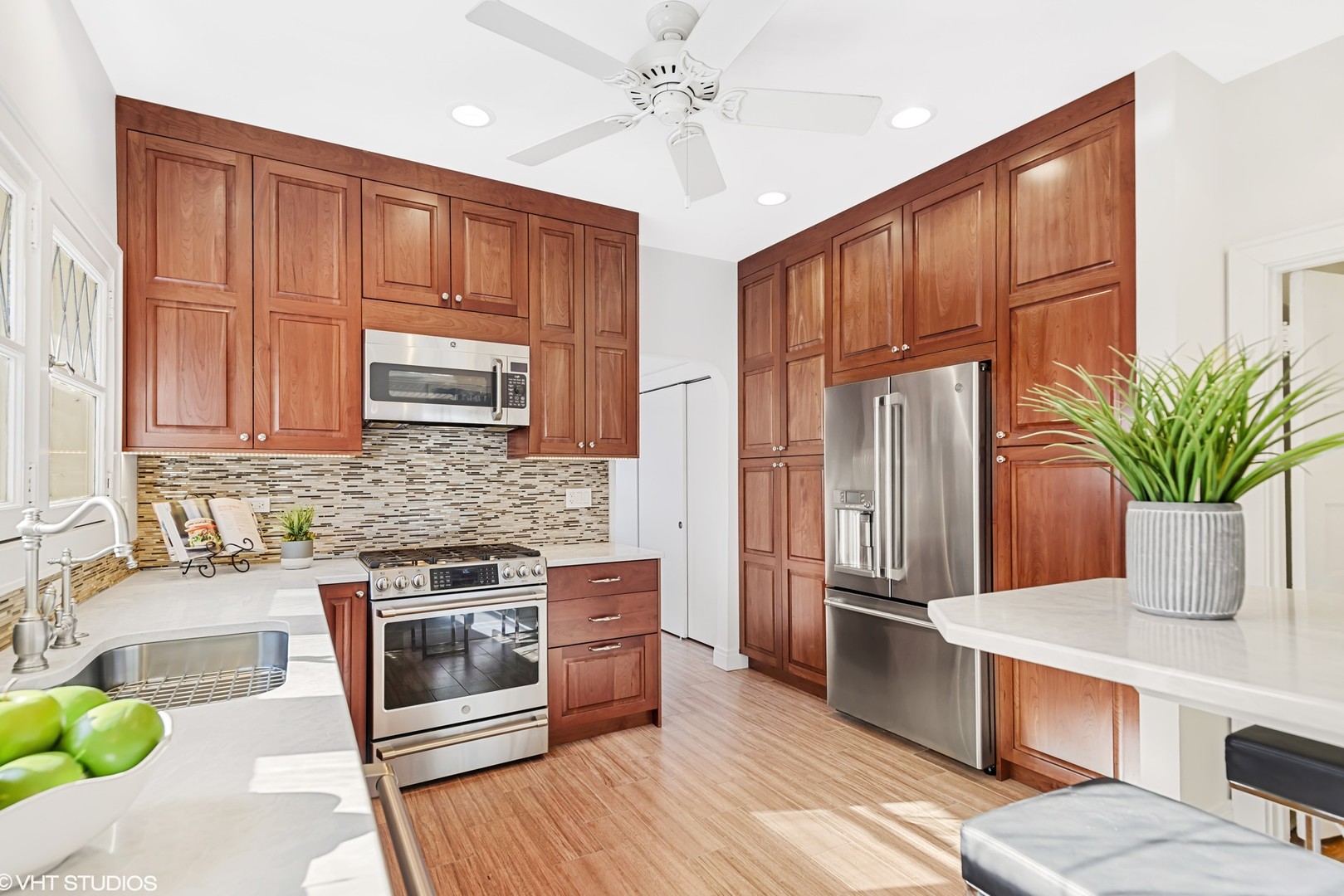 924 Sheridan Road Evanston, IL 60202 - Photo 12 of 34 a kitchen with stainless steel appliances granite countertop a refrigerator a stove a sink cabinets