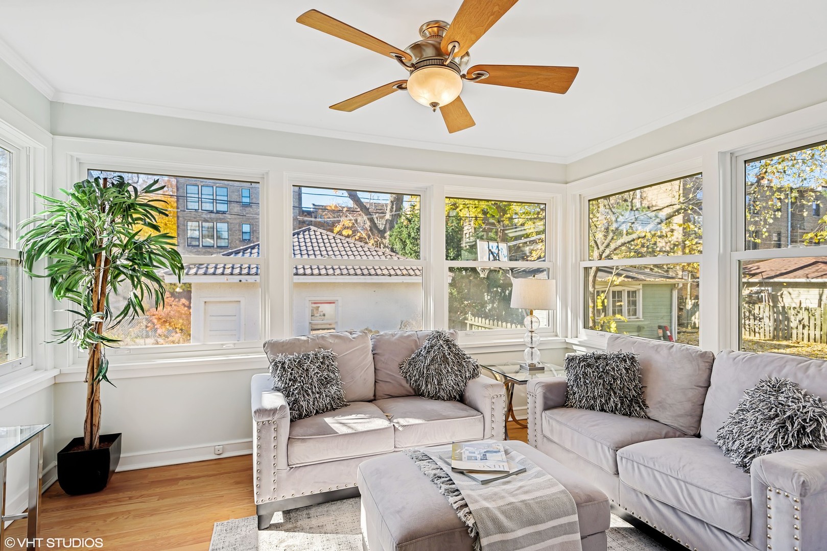 924 Sheridan Road Evanston, IL 60202 - Photo 17 of 34 a living room with furniture and a large window with wooden floor
