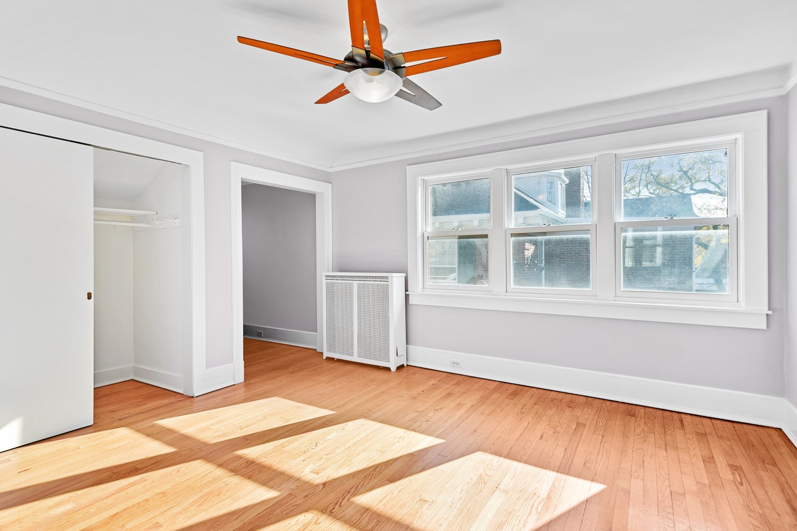924 Sheridan Road Evanston, IL 60202 - Photo 21 of 34 a view of an empty room with window and wooden floor