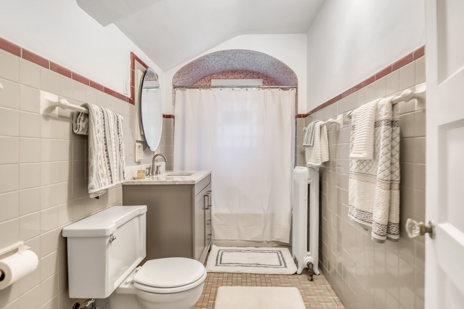 924 Sheridan Road Evanston, IL 60202 - Photo 25 of 34 a bathroom with a granite countertop sink a toilet a mirror and shower
