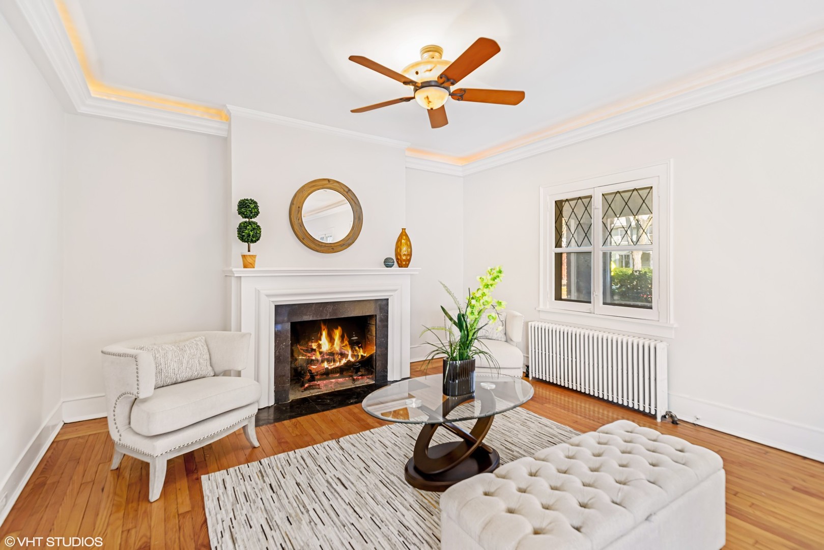 924 Sheridan Road Evanston, IL 60202 - Photo 4 of 34 a living room with furniture a rug and a fireplace