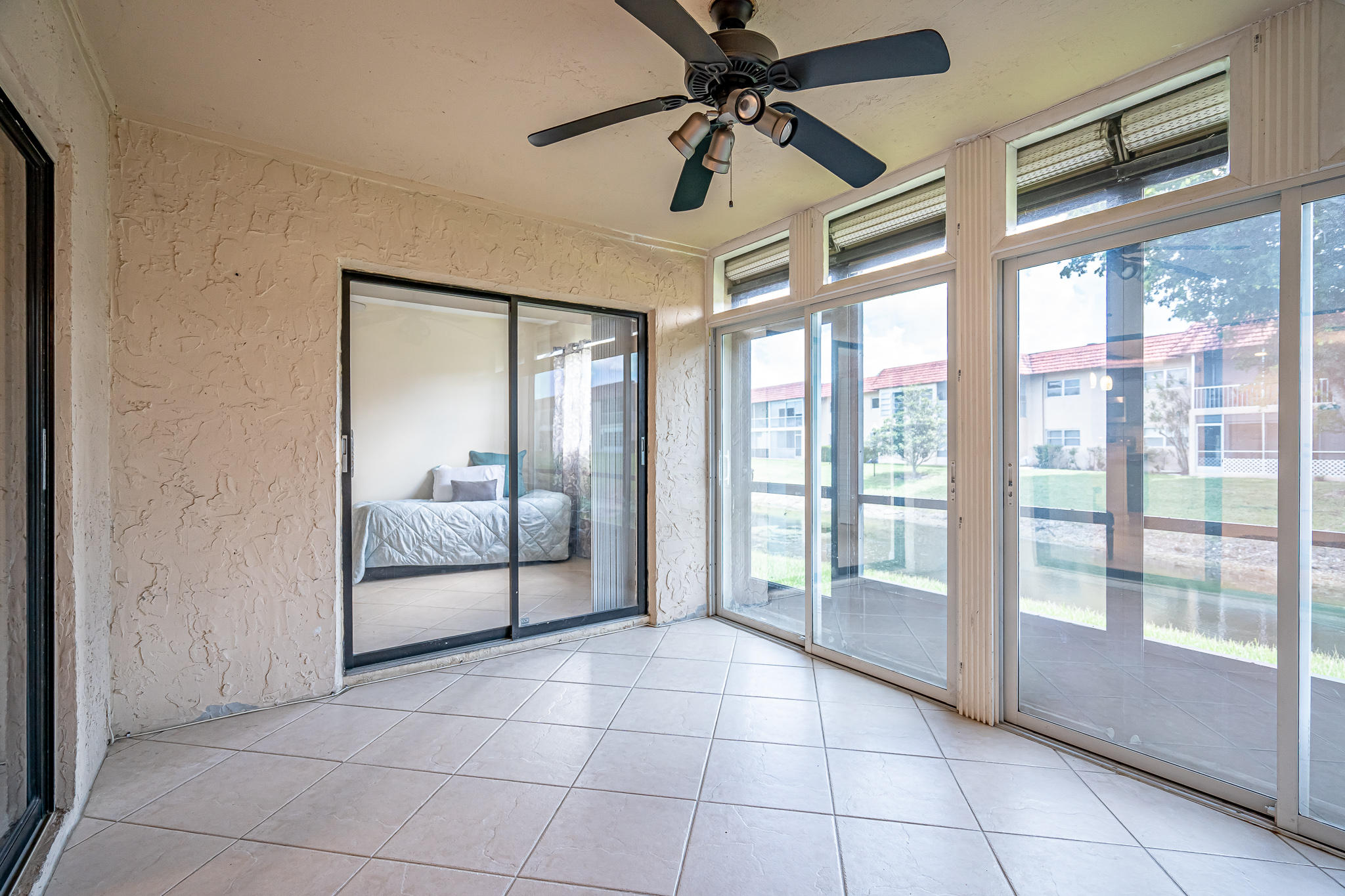 22394 Benidorm Drive Boca Raton, FL 33428 - Photo 26 of 29 Enclosed Porch