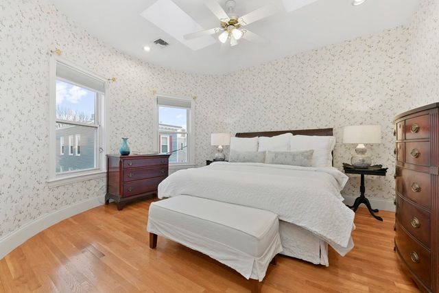 a bedroom with bed and window