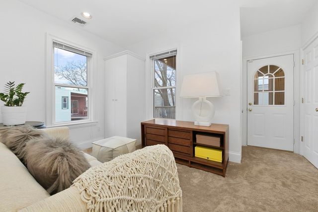 a bedroom with bed and window