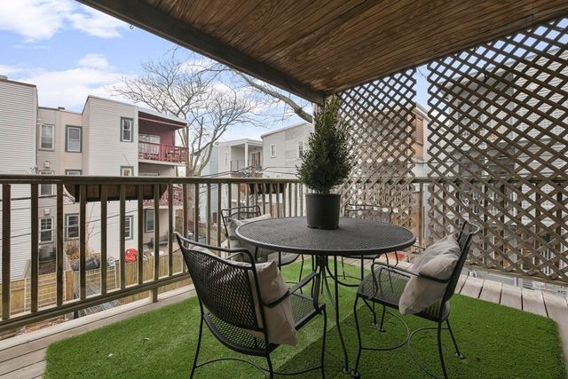 a view of a chairs and table in the patio