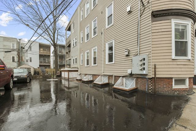 a view of a white building among the street