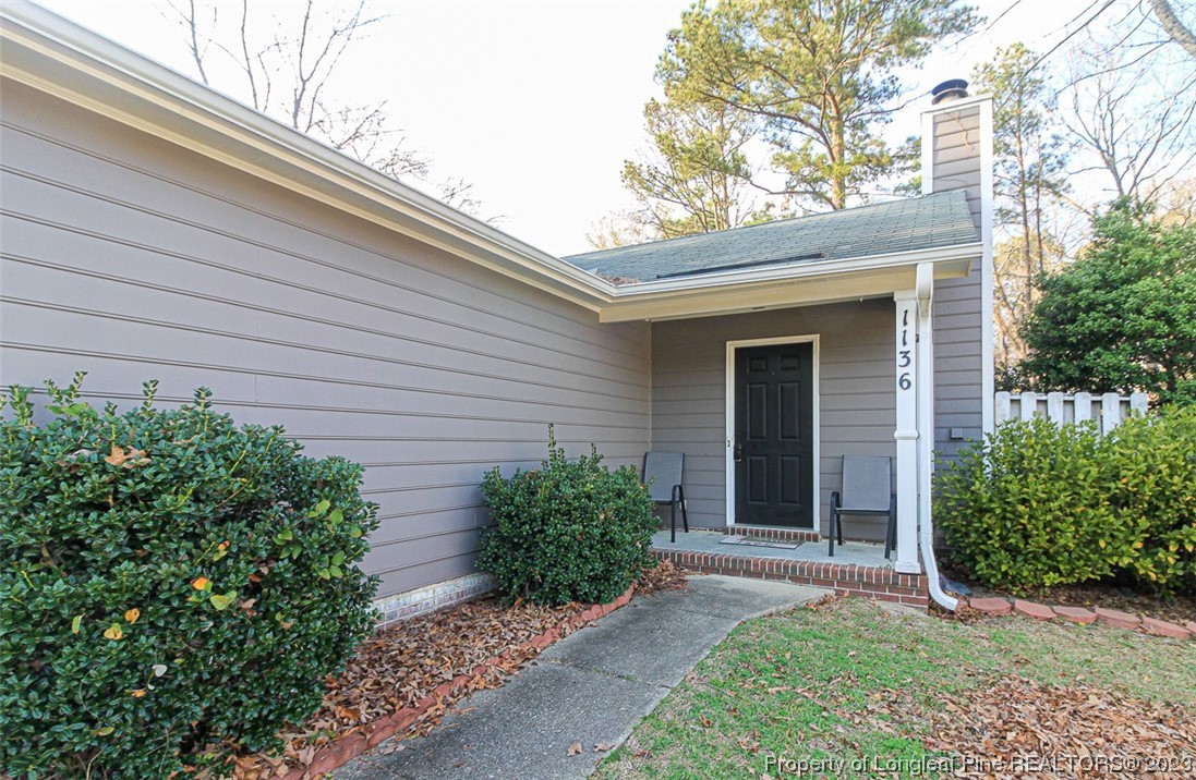 1136 Hoke Loop Road Fayetteville, NC 28314 - Photo 3 of 20 front view of a house with a yard