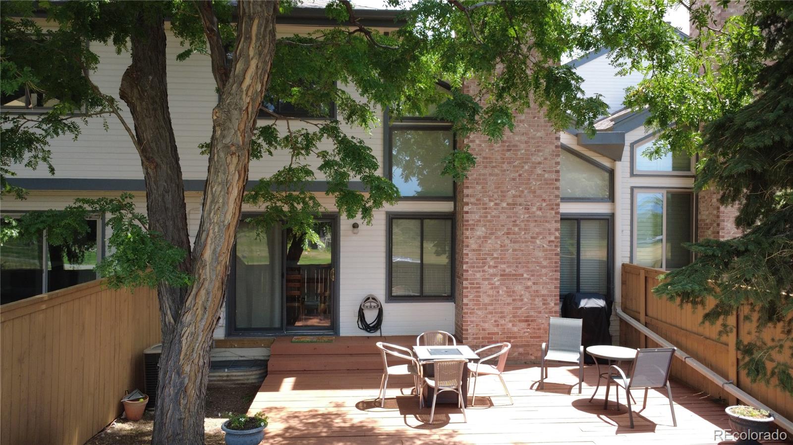 6579 South Jackson Street Centennial, CO 80121 - Photo 25 of 35 a view of a patio with table and chairs and potted plants