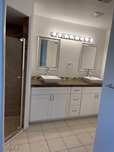 1237 Chrysler Street Lehigh Acres, FL 33974 - Photo 20 of 30 a bathroom with a granite countertop sink and a mirror