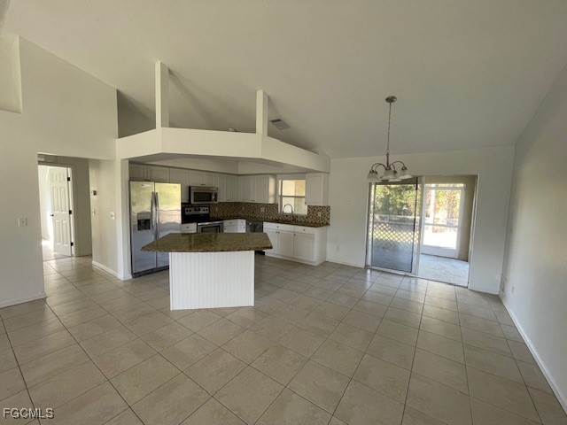 1237 Chrysler Street Lehigh Acres, FL 33974 - Photo 2 of 30 a view of kitchen with refrigerator and window