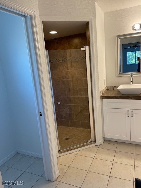 1237 Chrysler Street Lehigh Acres, FL 33974 - Photo 21 of 30 a bathroom with a granite countertop sink a mirror and a shower