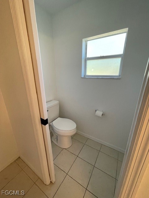 1237 Chrysler Street Lehigh Acres, FL 33974 - Photo 22 of 30 a bathroom with a toilet