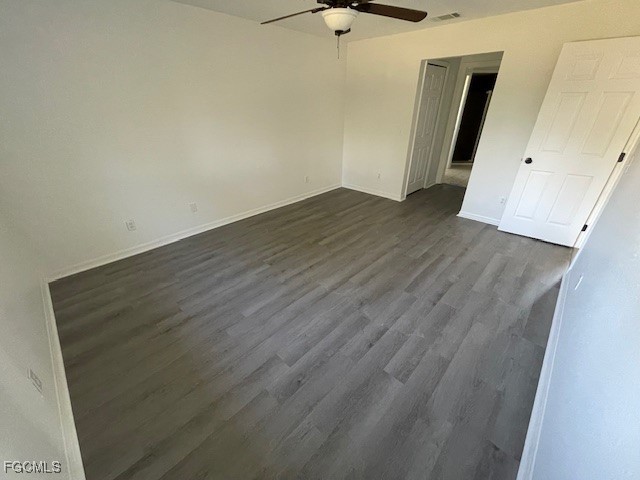 1237 Chrysler Street Lehigh Acres, FL 33974 - Photo 24 of 30 an empty room with wooden floor