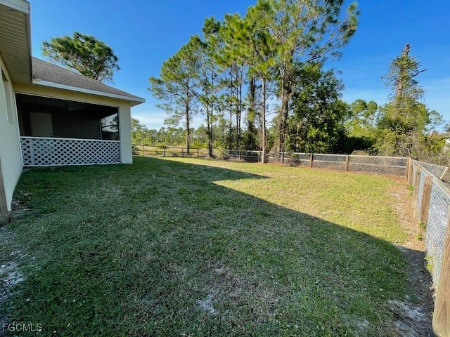 1237 Chrysler Street Lehigh Acres, FL 33974 - Photo 28 of 30 a view of a swimming pool with an outdoor space and seating area