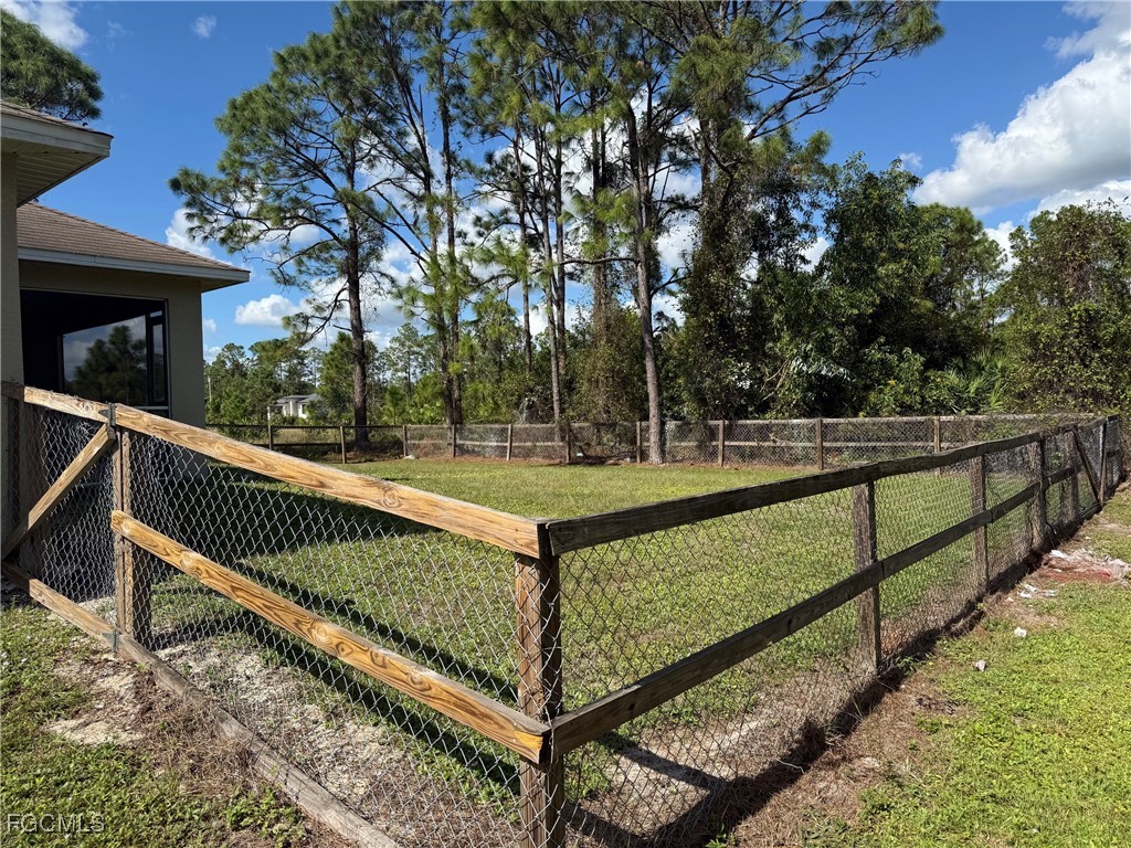 1237 Chrysler Street Lehigh Acres, FL 33974 - Photo 29 of 30 a view of a bench in a balcony