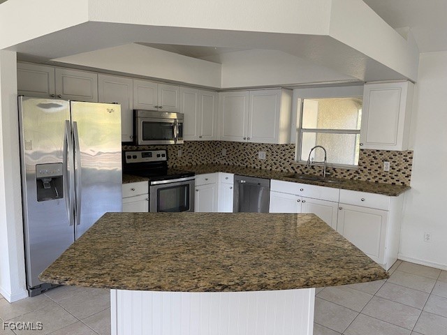 1237 Chrysler Street Lehigh Acres, FL 33974 - Photo 3 of 30 a kitchen with kitchen island granite countertop a sink and counter top space