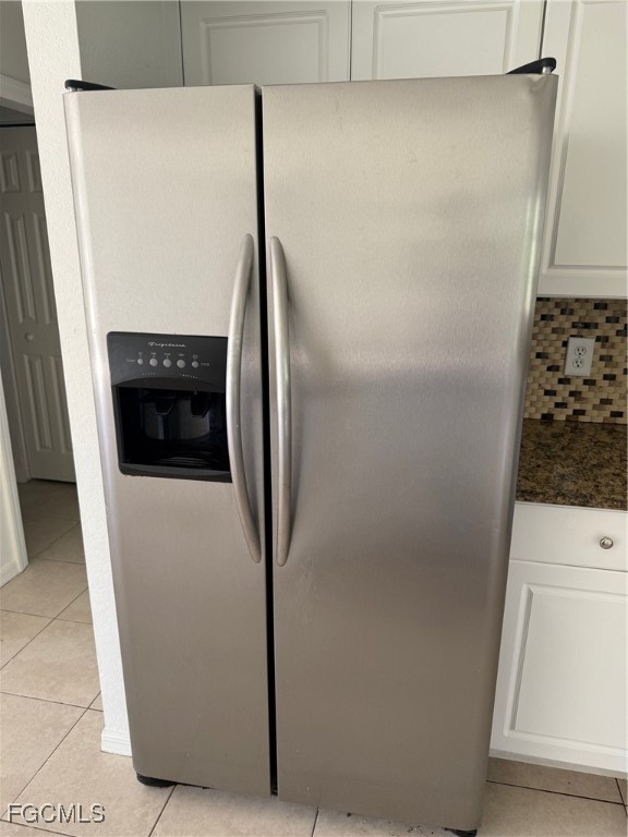 1237 Chrysler Street Lehigh Acres, FL 33974 - Photo 6 of 30 a close view of a refrigerator in kitchen and a refrigerator