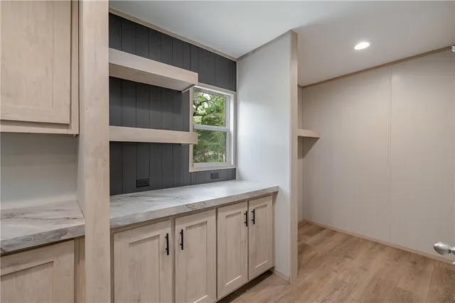 a kitchen with a sink and a mirror