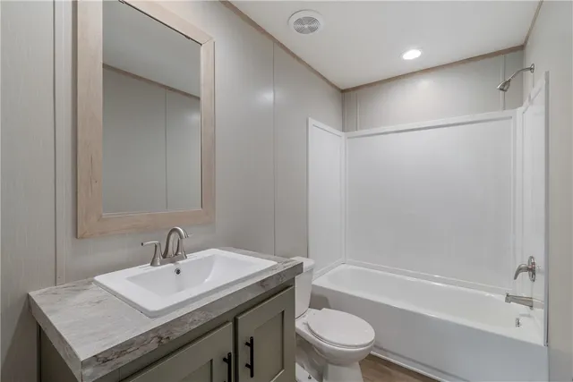 a bathroom with a sink toilet and a bathtub