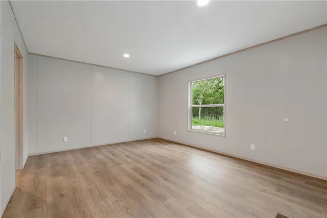 a view of room with window and hardwood floor