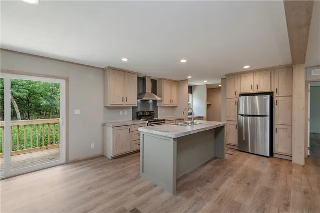 a kitchen with a stove a sink and a refrigerator