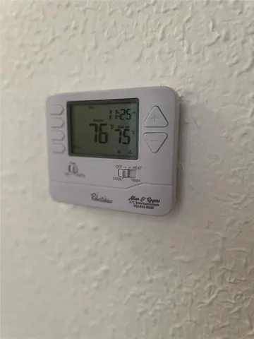 a living room with furniture and a lamp