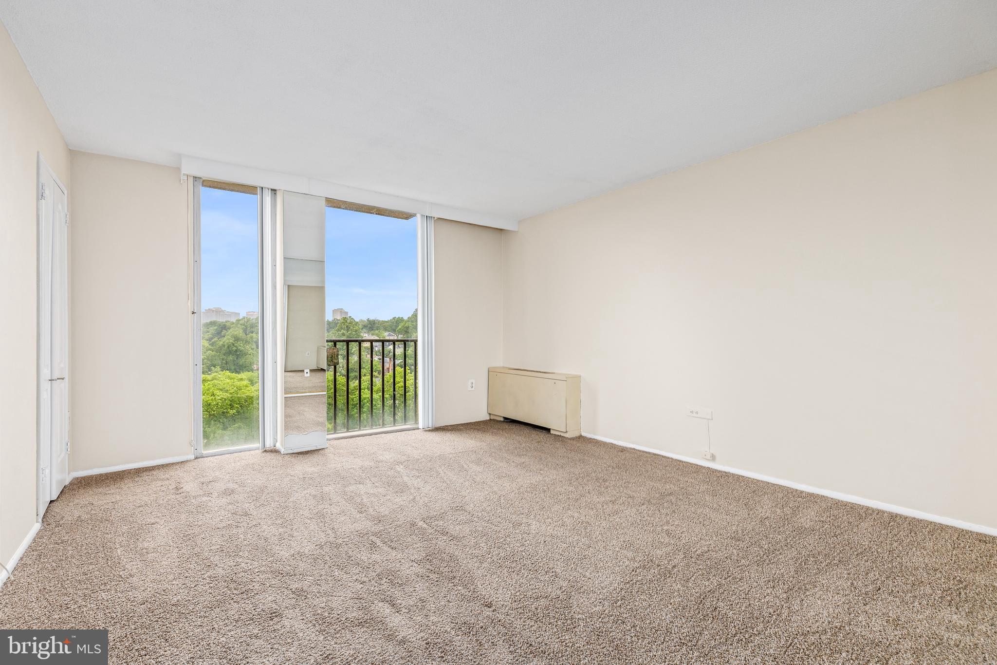 4600 South Four Mile Run Drive, Unit 1142 Arlington, VA 22204 - Photo 17 of 34 a view of an empty room with a balcony