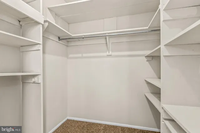 a view of an empty walk in closet