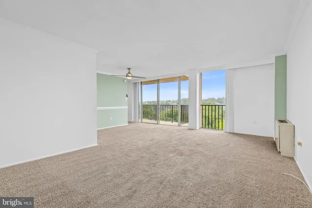 a view of an empty room with a balcony
