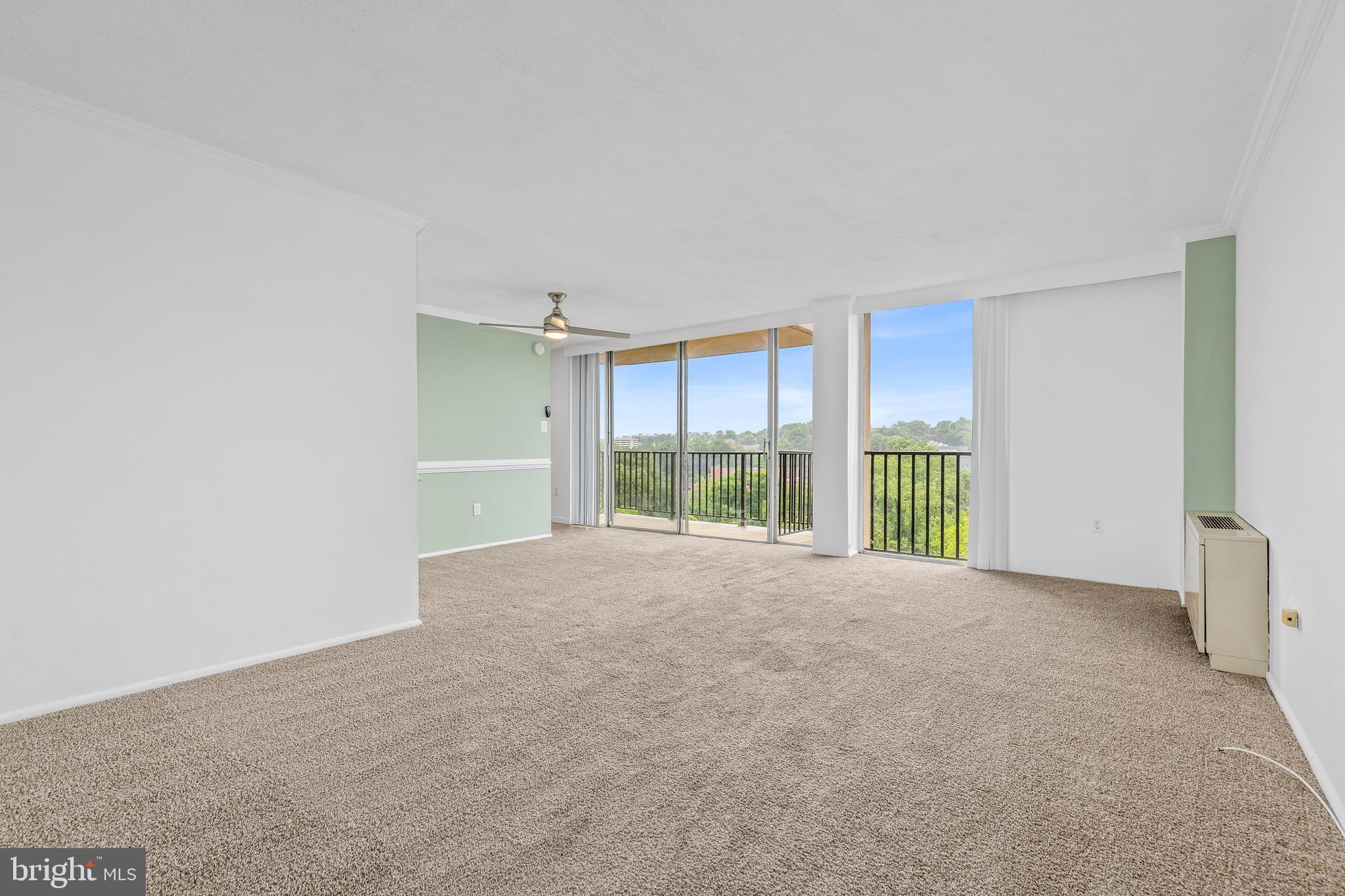 4600 South Four Mile Run Drive, Unit 1142 Arlington, VA 22204 - Photo 2 of 34 a view of an empty room with a balcony