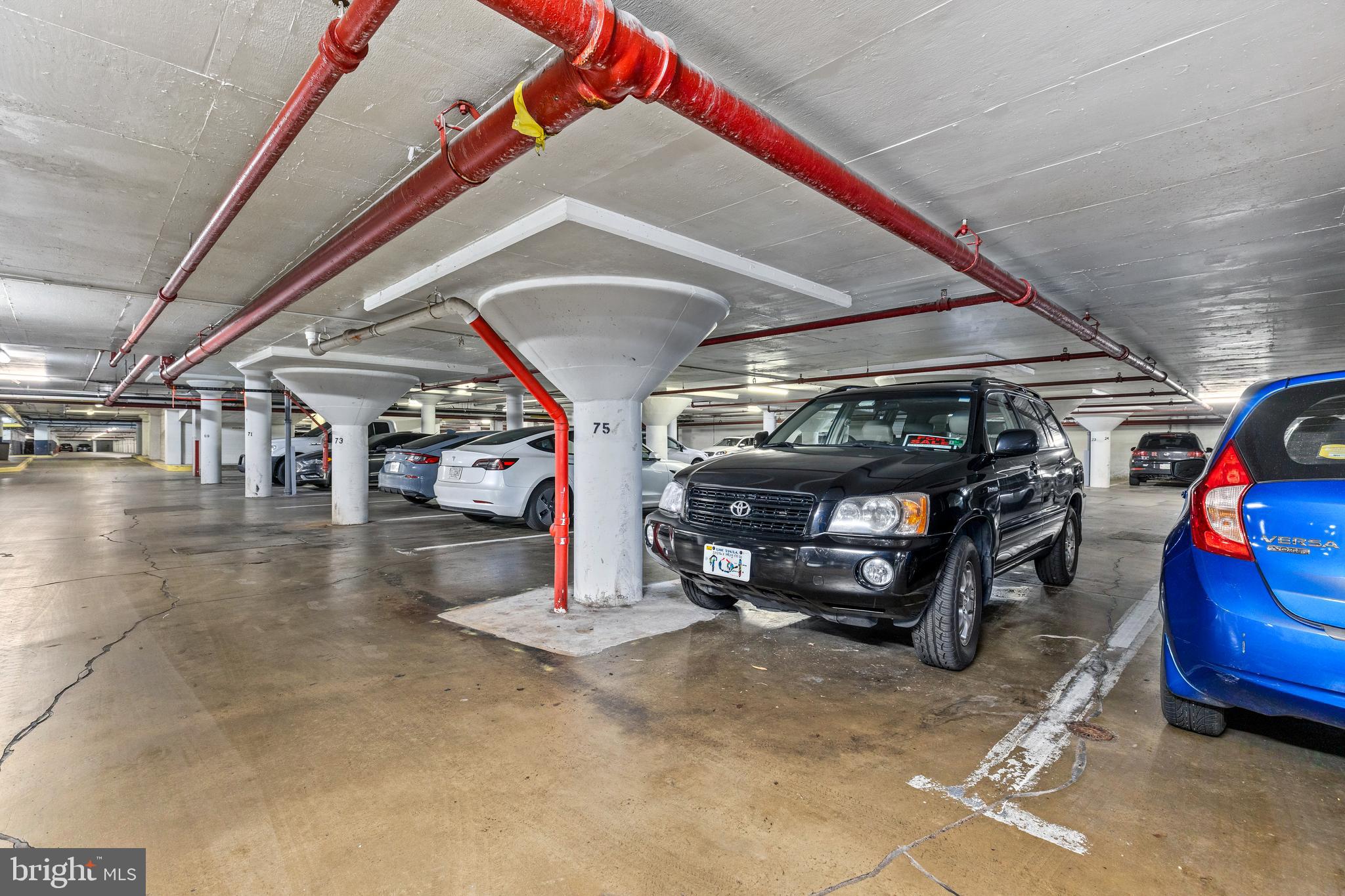 4600 South Four Mile Run Drive, Unit 1142 Arlington, VA 22204 - Photo 23 of 34 a view of parking garage with cars parked