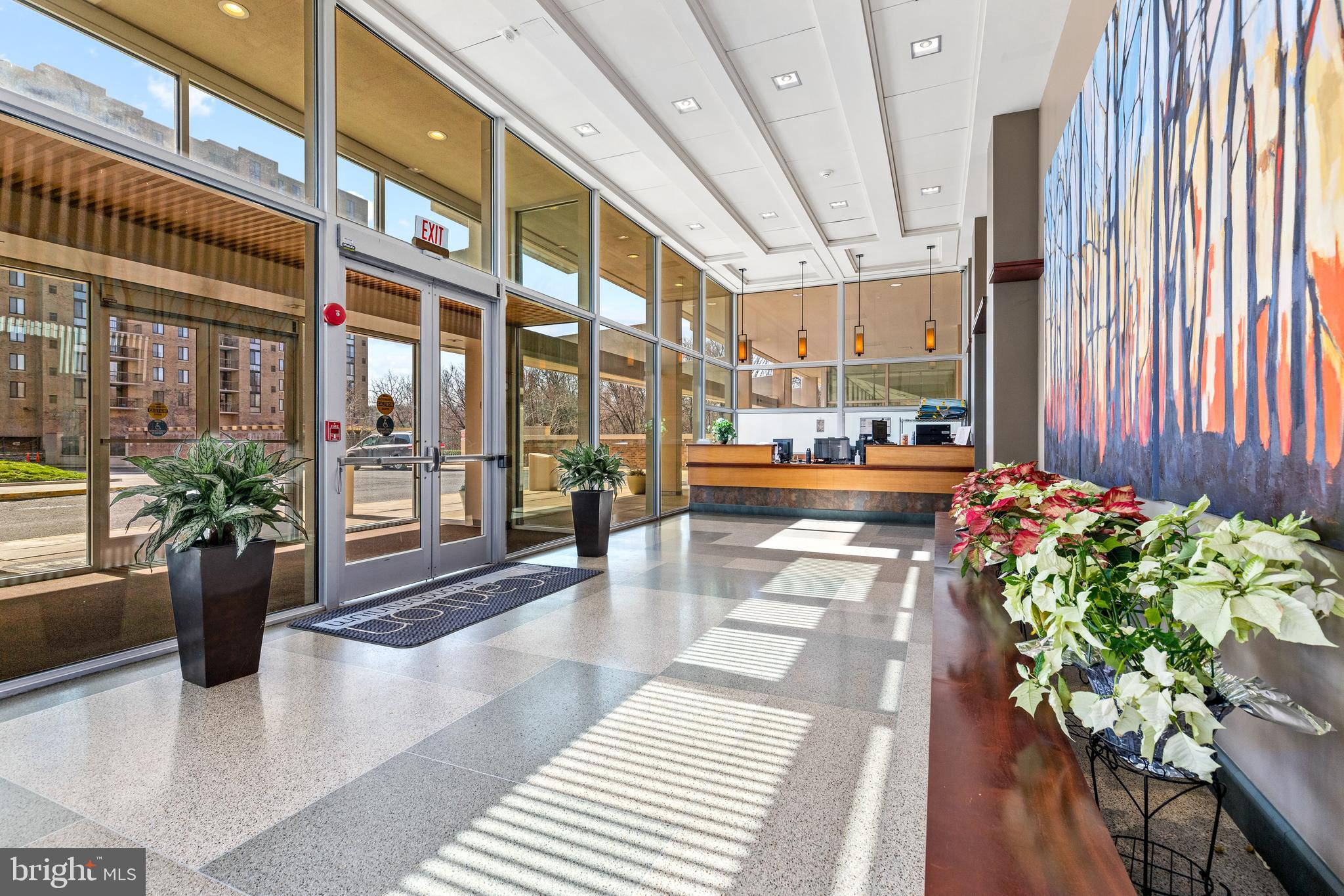 4600 South Four Mile Run Drive, Unit 1142 Arlington, VA 22204 - Photo 24 of 34 a lobby with furniture and flowers