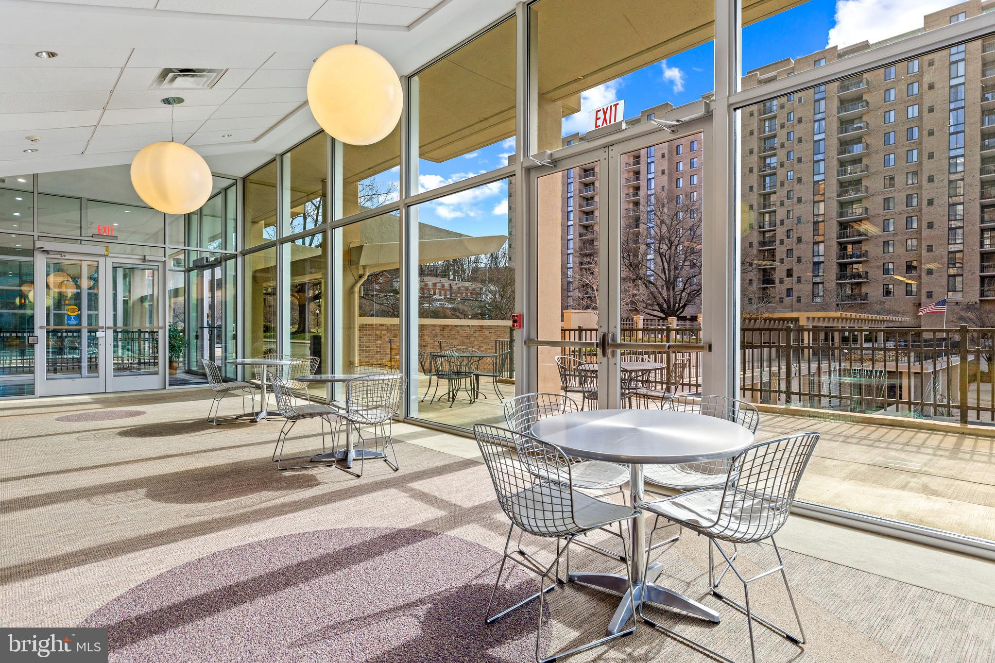 4600 South Four Mile Run Drive, Unit 1142 Arlington, VA 22204 - Photo 27 of 34 a view of a dining room with furniture and a large window
