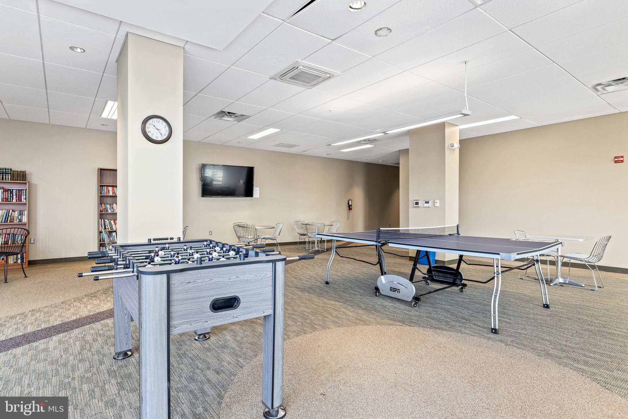 4600 South Four Mile Run Drive, Unit 1142 Arlington, VA 22204 - Photo 29 of 34 a reading room with furniture pool table and flat screen tv