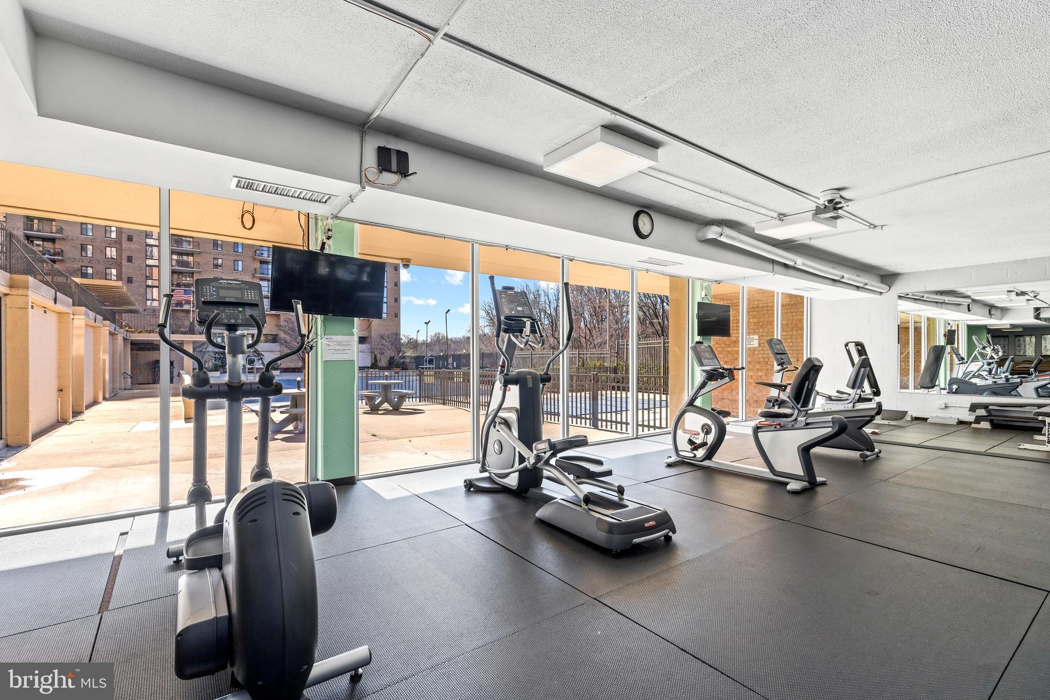 4600 South Four Mile Run Drive, Unit 1142 Arlington, VA 22204 - Photo 31 of 34 a view of a gym with large windows