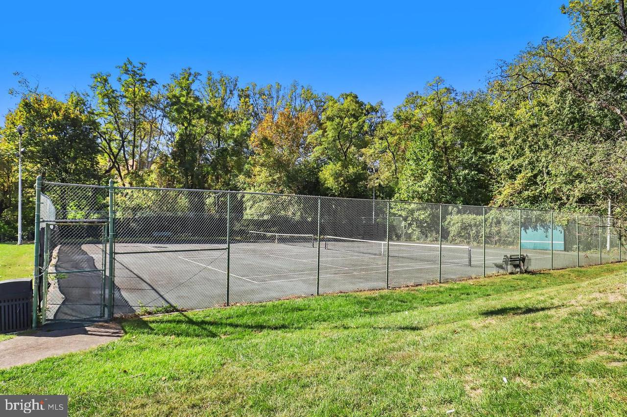 4600 South Four Mile Run Drive, Unit 1142 Arlington, VA 22204 - Photo 33 of 34 a view of a backyard with a garden and entertaining space