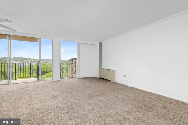 a view of an empty room with a balcony