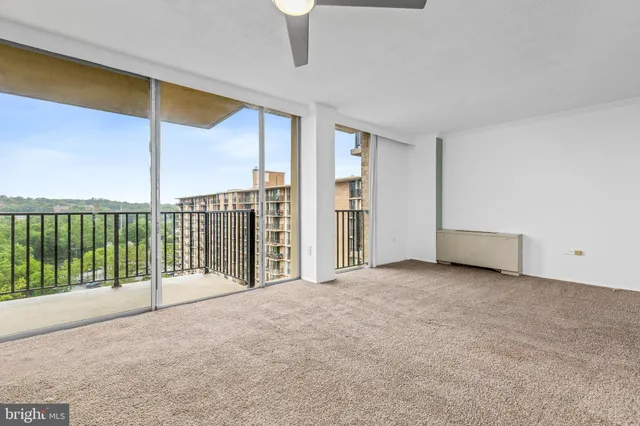 a view of a room with sliding door and wooden floor