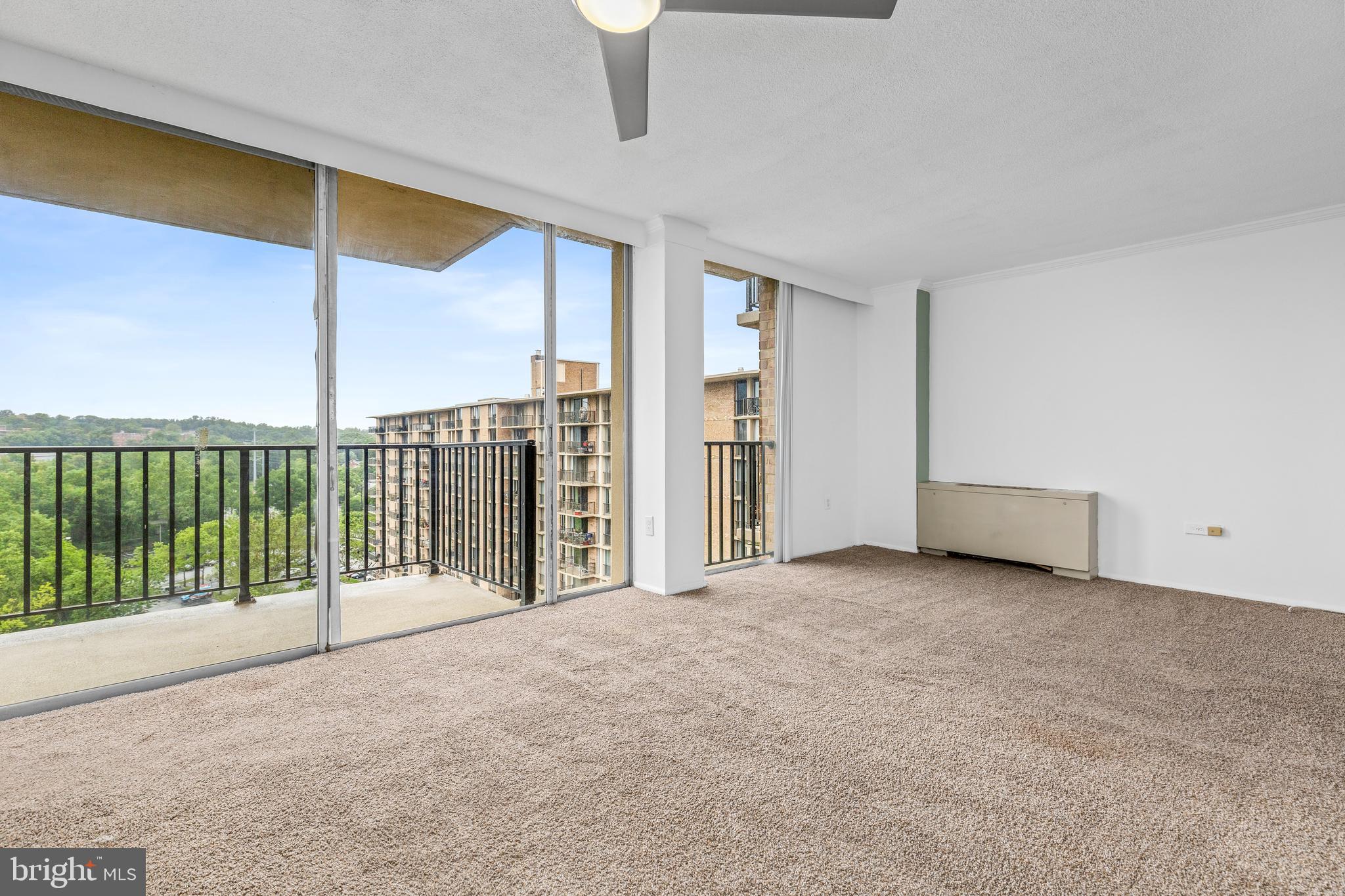 4600 South Four Mile Run Drive, Unit 1142 Arlington, VA 22204 - Photo 5 of 34 a view of a room with sliding door and wooden floor