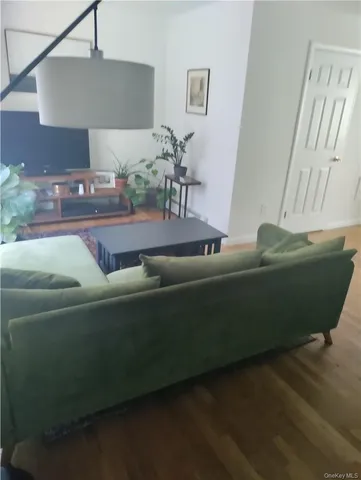 a kitchen with granite countertop a sink a stove and cabinets
