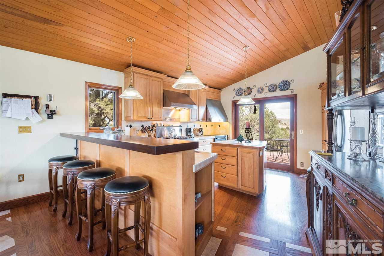 2570 Musket Road Reno, NV 89521 - Photo 4 of 25 a dining hall with stainless steel appliances granite countertop a stove and a refrigerator
