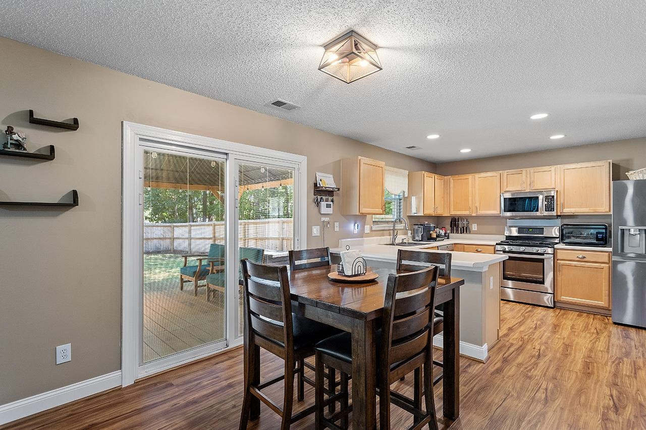 6 Esterbrook Court Durham, NC 27703 - Photo 11 of 31 a view of a dining room with furniture window and wooden floor