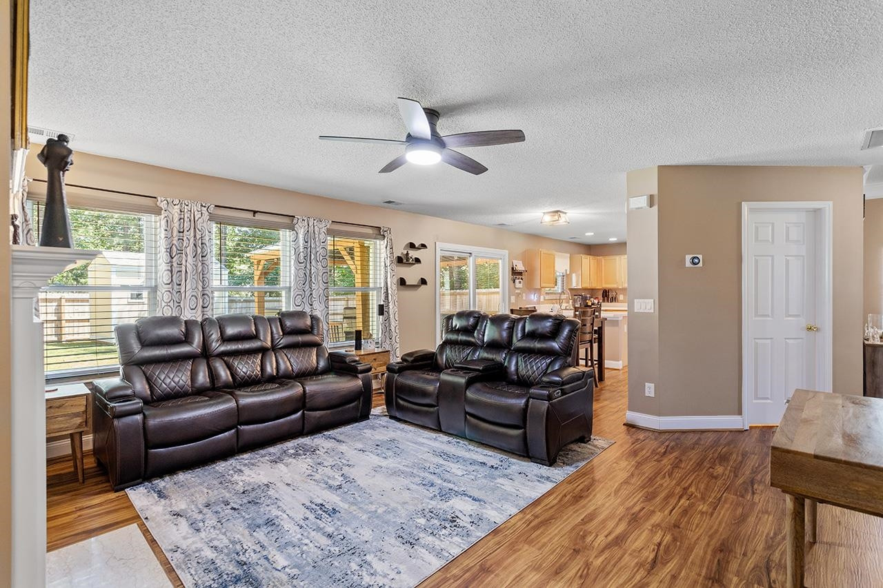 6 Esterbrook Court Durham, NC 27703 - Photo 14 of 31 a living room with furniture fireplace and a large window