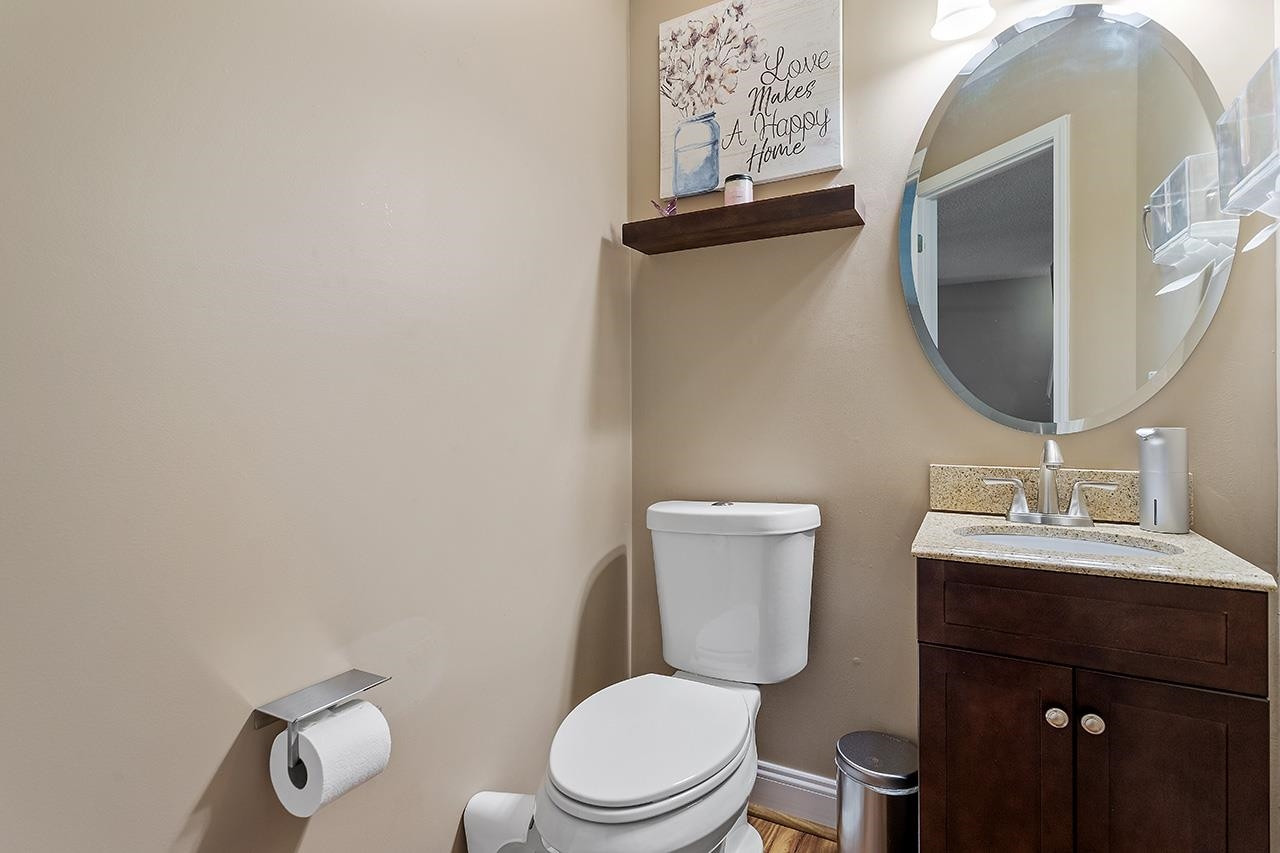 6 Esterbrook Court Durham, NC 27703 - Photo 15 of 31 a white toilet sitting next to a bathroom sink