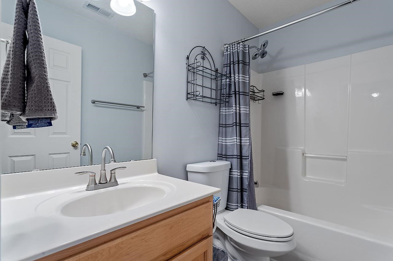 6 Esterbrook Court Durham, NC 27703 - Photo 23 of 31 a bathroom with a sink toilet and shower