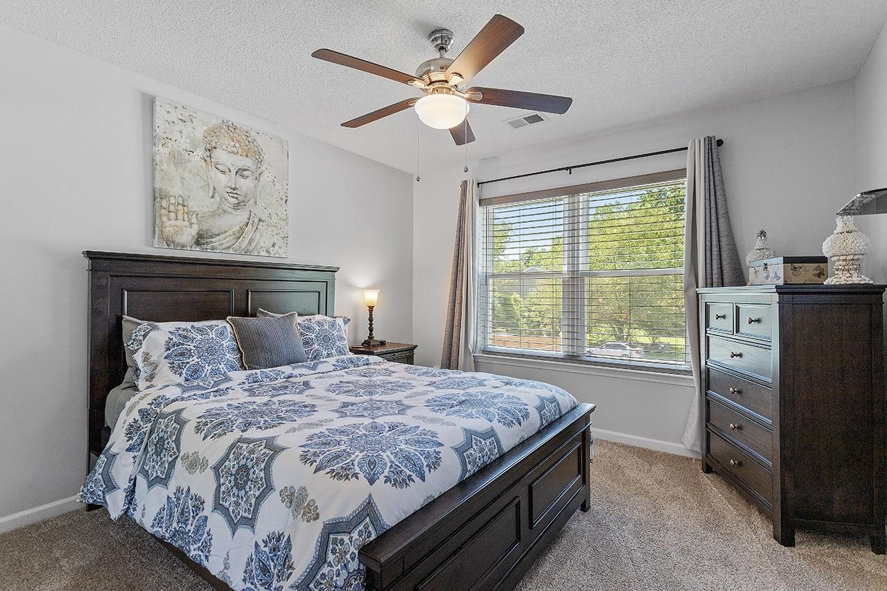 6 Esterbrook Court Durham, NC 27703 - Photo 24 of 31 a bedroom with a bed and a window